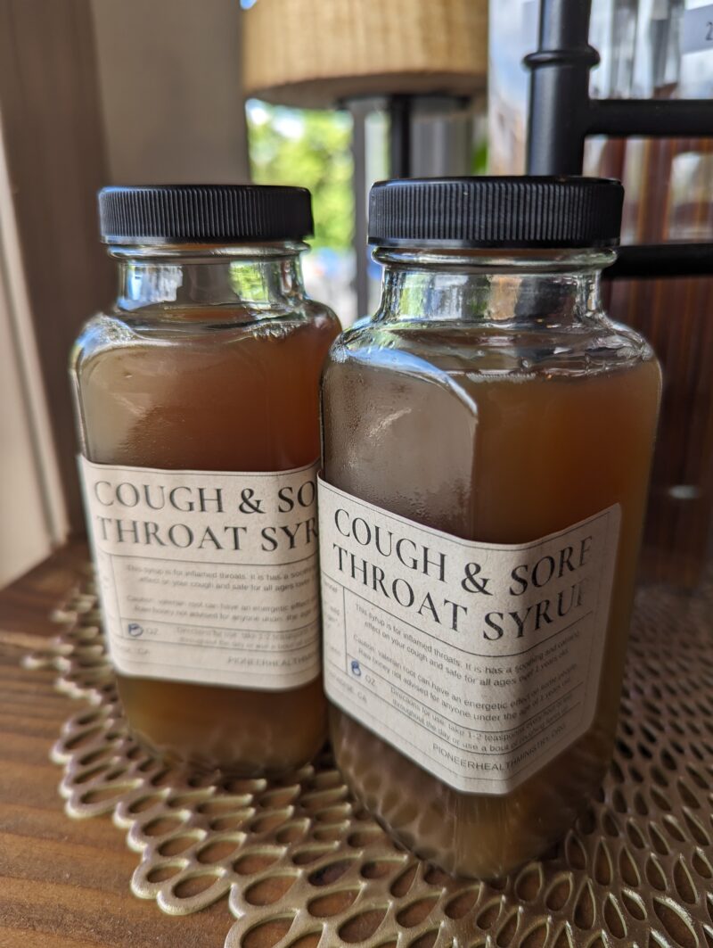 cough and sore throat syrup bottles