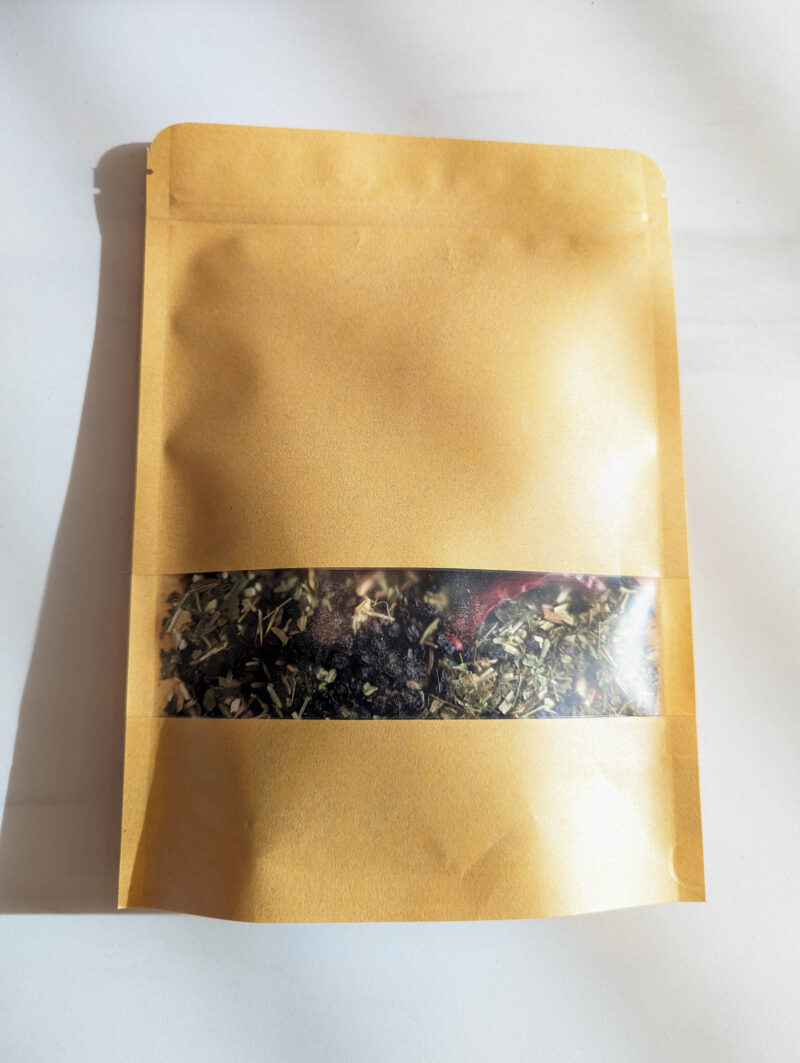 dried herbs elderberry cinnamon stick rose hips ginger root echinacea cayenne pepper in brown bag