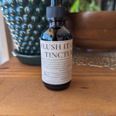 flush it out tincture on wood board