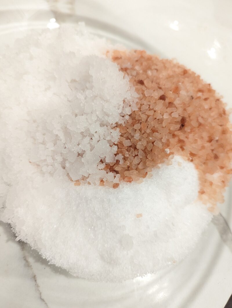 epsoms salt, pink Himalayan salt, magnesium chloride flakes in a glass bowl