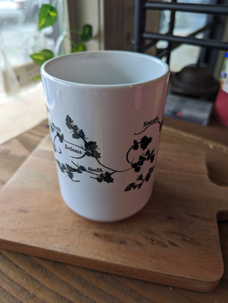 vine and branch logo handmade ceramic mug