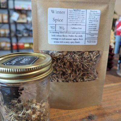 winter spice tea on wood counter with smell jar