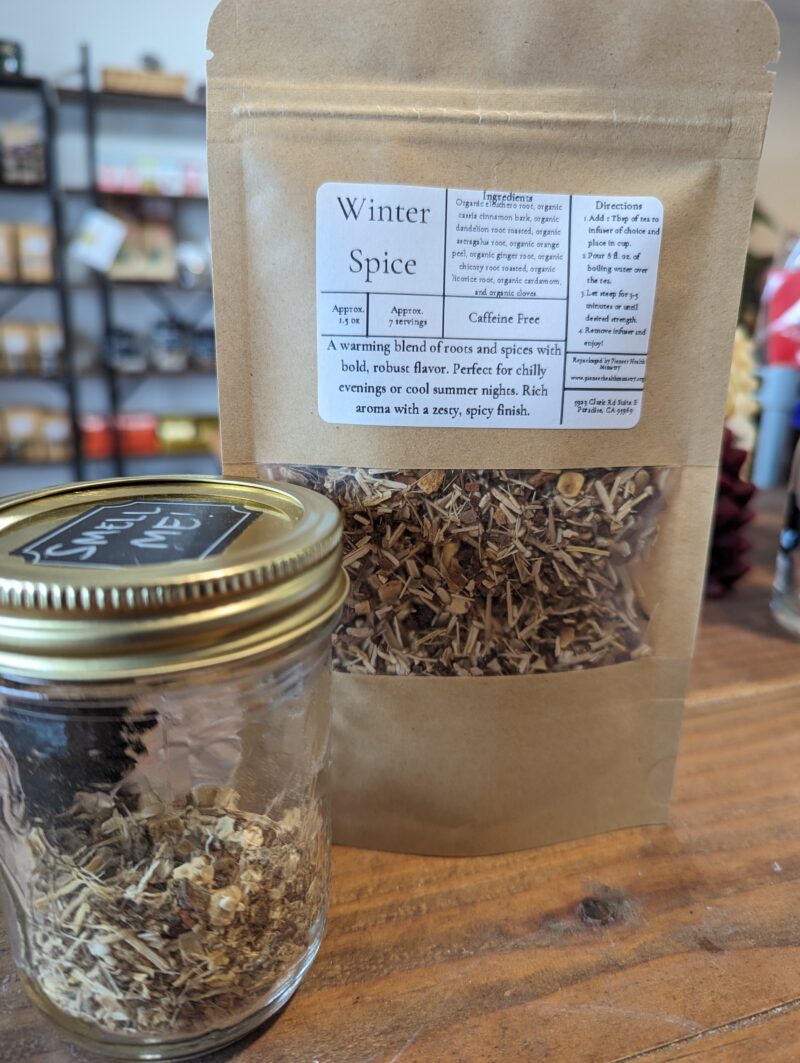 winter spice tea on wood counter with smell jar